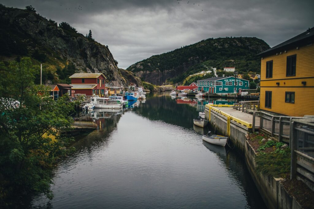 a body of water with boats and buildings along it