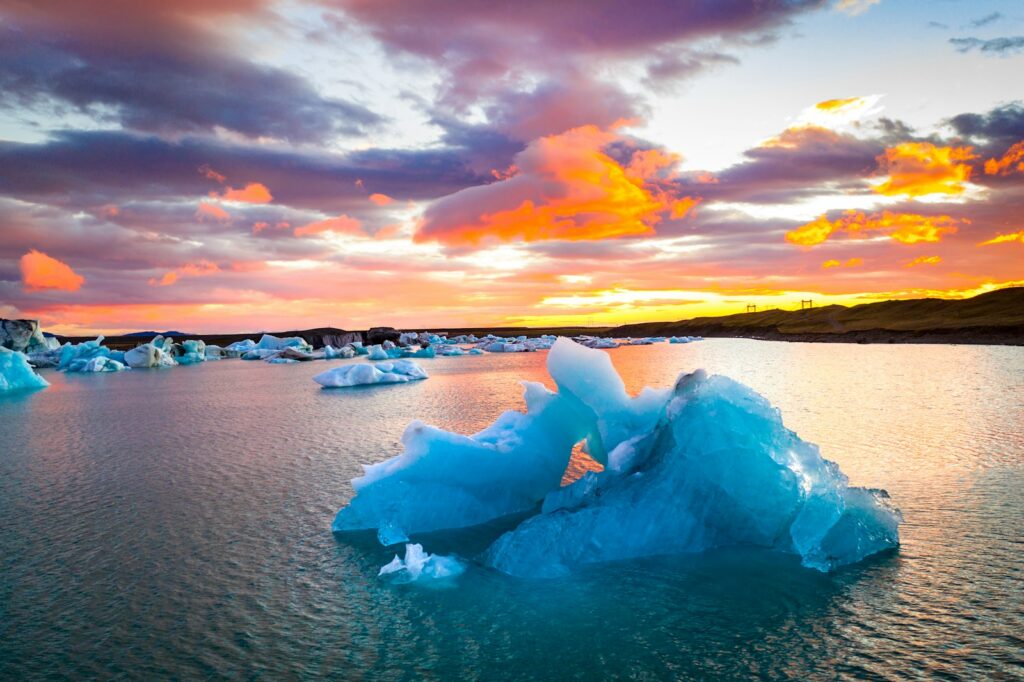 ice blocks on the shore during sunset